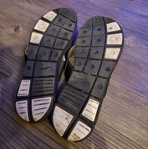 Well worn Nike slides